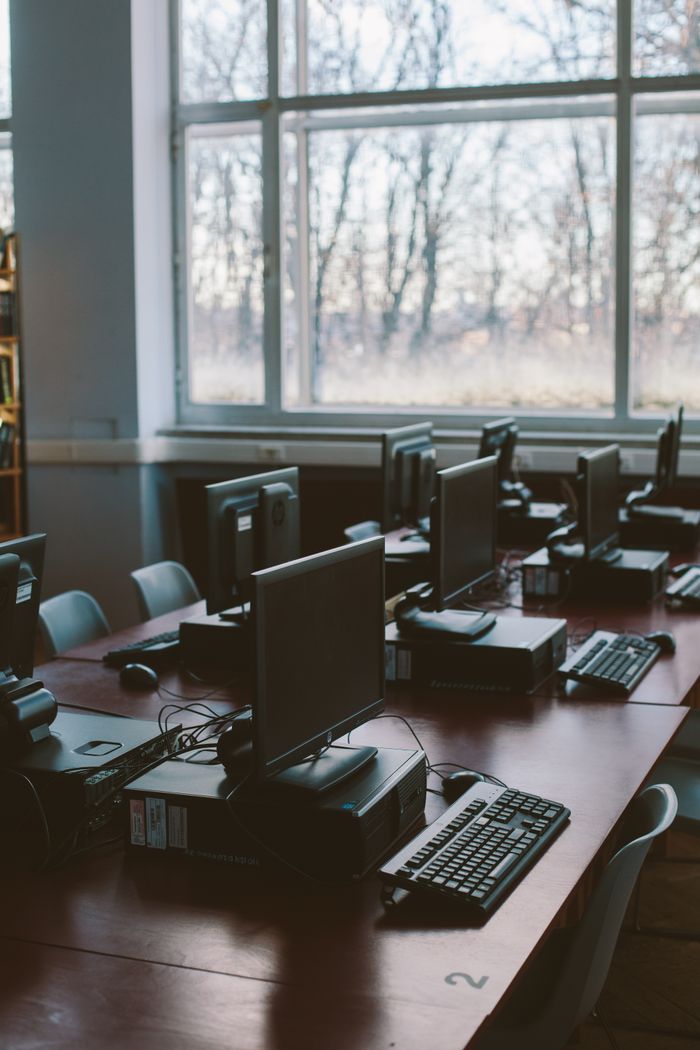 The Art of Drawing Readers In: Your attractive post title goes here Spacious computer lab with rows of monitors and keyboards in a sunlit room.